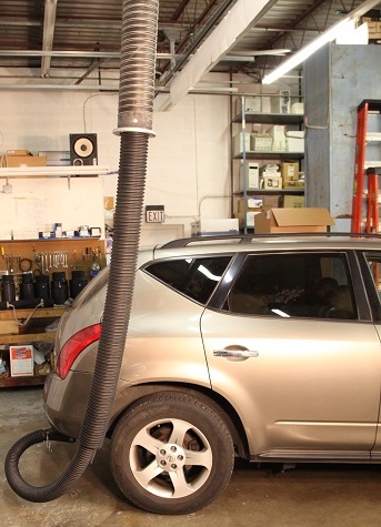 Crushproof hose shown in a telescoping system and attached to a passenger vehicle to remove garage exhaust.
