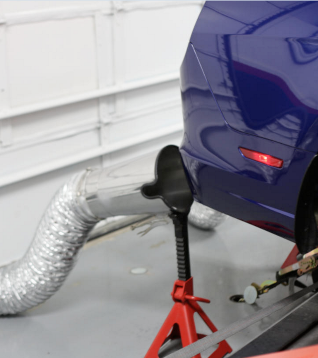 Fume-A-Vent dyno exhaust extraction system shown installed during dynamometer testing.