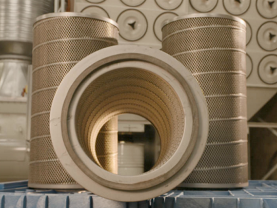 Replacement industrial cartridge filters placed in front of a dust collection system.