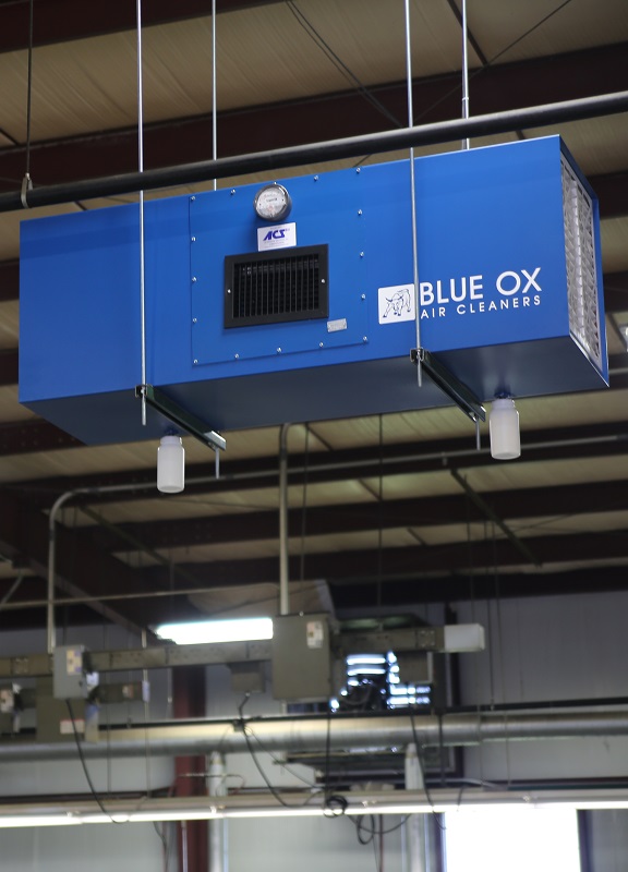Blue Ox air filtration system installed in an industrial manufacturing facility.
