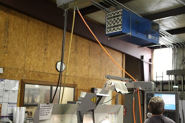 Blue Ox industrial air cleaner installed about work area at Spring Creek Machining.