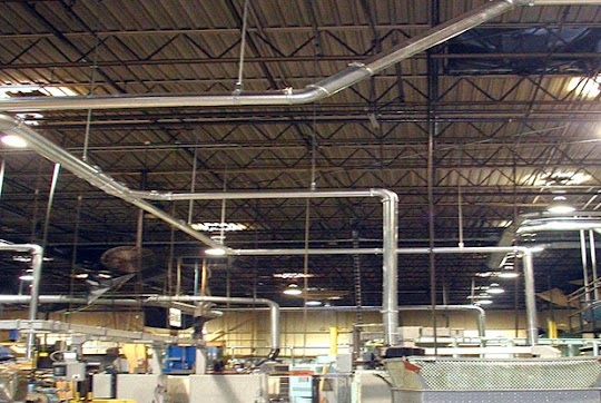 Image of nordfab ducting sustem being used in a welding shop