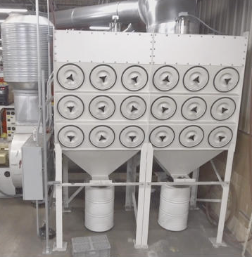 Dynamo Dust Collector shown installed in an industrial facility to remove fine dust and other harmful particulate. 