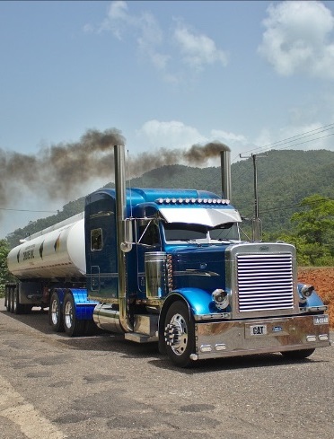 Diesel engine truck producing emissions.