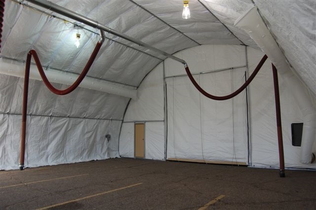 Rope and Pulley Simple Drop Systems installed in a military humvee repair and maintenance tent.