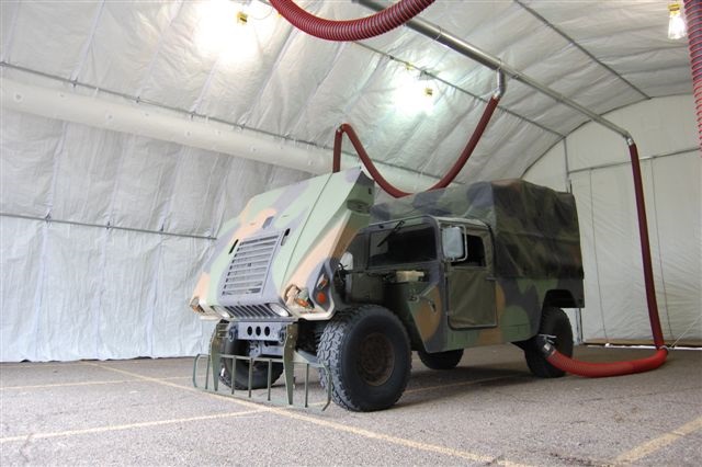A Rope and Pulley Simple Drop System shown attached to a military humvee for vehicle exhaust removal.