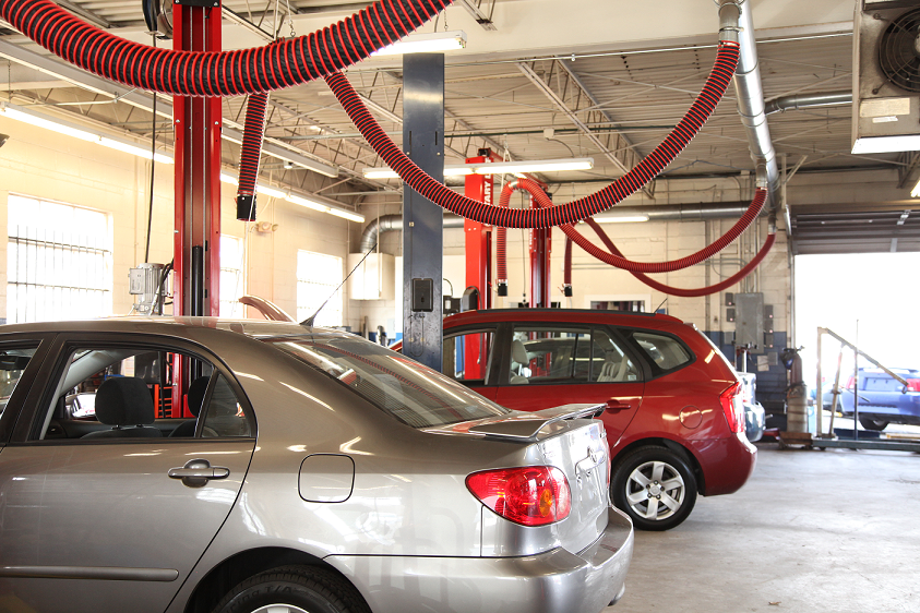 Fume-A-Vent simple drop systems show in an auto dealership installation.