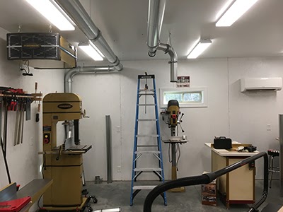 Wood dust ducting shown installed in a specialty woodshop.