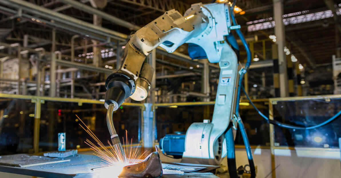Robotic Welding fumes and sparks during operation.