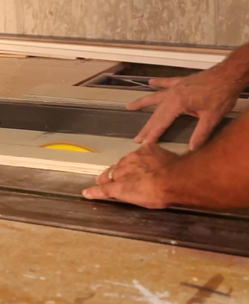 Woodworker cutting a work piece.